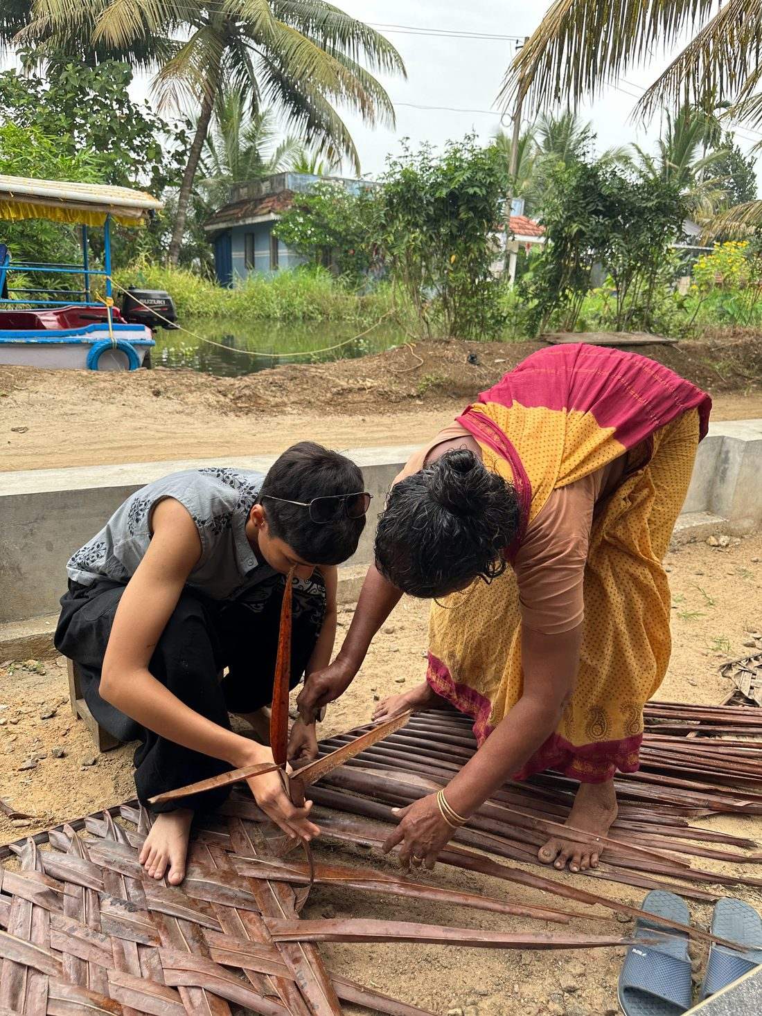 Prerna learning to weave palm fronds